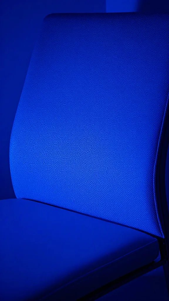closeup of electric blue accent light behind a chair